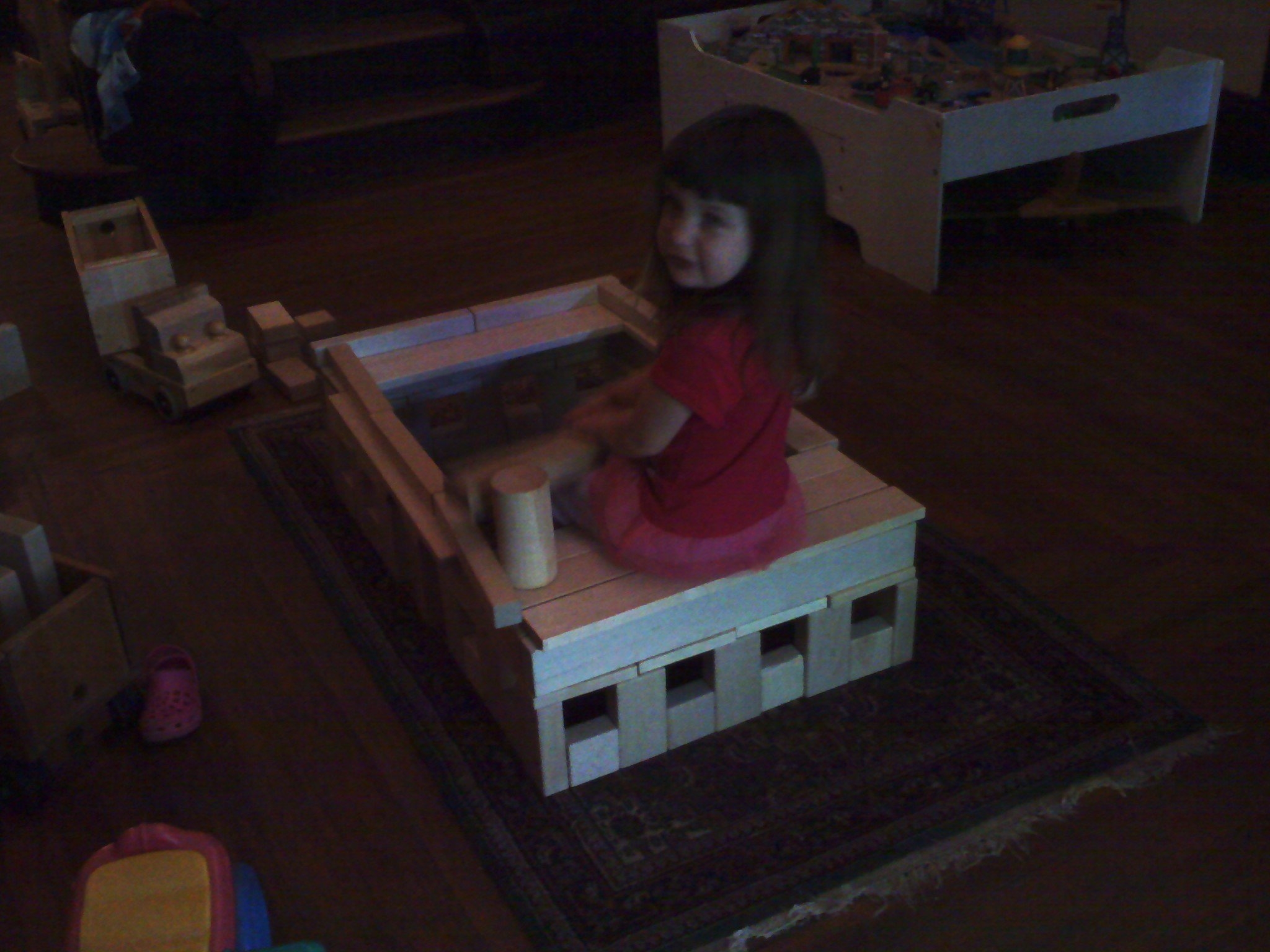 Photo of Livea playing with her hospital made from a CP61 Quarter Classroom Set of Hard Rock Maple Wooden Unit Blocks.